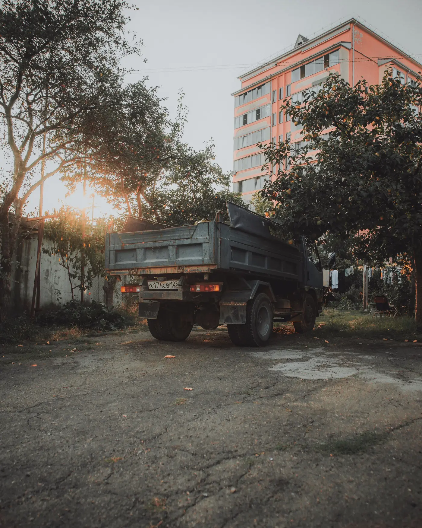 A work truck parked in low evening sun